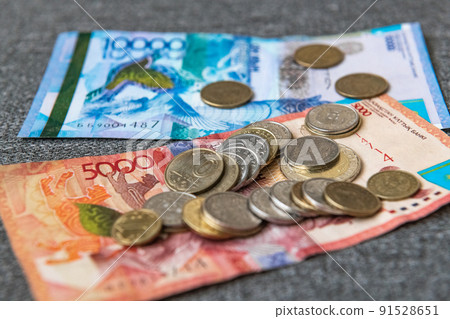 Thick wad of money cash on table Thick wad of money cash on table 91528651