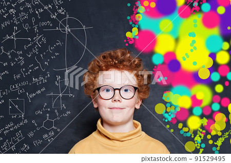 Cute little boy face on science and arts pattern on chalkboard background 91529495