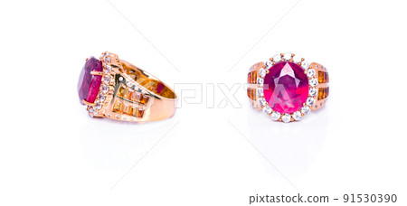 Burma Ruby with orange sapphires and white quartz ring on white background with reflection. Collection of natural gemstones accessories. Studio shot Burma Ruby with orange sapphires and white quartz ring on white background with reflection. Collection of natural gemstones accessories. Studio shot 91530390