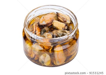 Marinated mussels isolated in a jar on a white background. Full depth of field. 91531245
