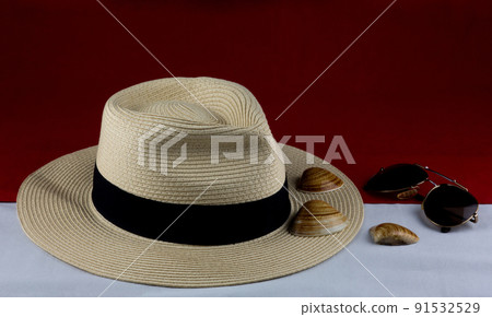 Panama Hat with Sunglasses and Sea Shells on Red and White 91532529