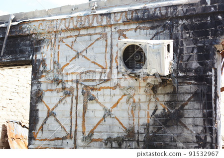 View from the ruined houses on the street after the air raid. 91532967