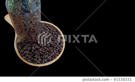 Coffee beans on a wooden plank and put in a glass bottle on a black background. 91538331