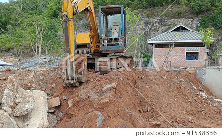 Crawler excavator front view digging on demolition site stop working or taking a break 91538336