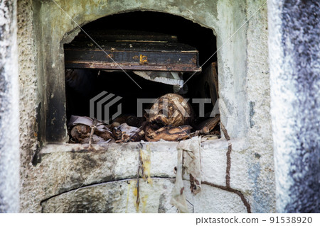Desecrated graves in the cemetery of the old town of Armero destroyed by an avalanche caused by the Nevado del Ruiz Volcano in 1985 in Colombia 91538920