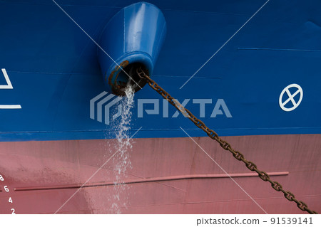 A cargo vessel that throws away ballast water A cargo vessel that throws away ballast water 91539141