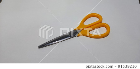 Scissors with orange handle 91539210