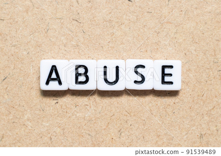 White tile alphabet letter with word abuse on wood background White tile alphabet letter with word abuse on wood background 91539489