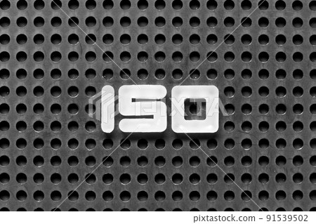 White alphabet letter in word iso on black pegboard background White alphabet letter in word iso on black pegboard background 91539502