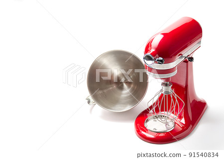 Red kitchen mixer with bowl on a white background and copy space. Red kitchen mixer with bowl on a white background and copy space. 91540834
