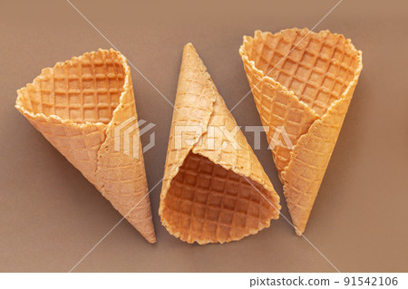 Empty wafer ice cream cone on table Empty wafer ice cream cone on table 91542106
