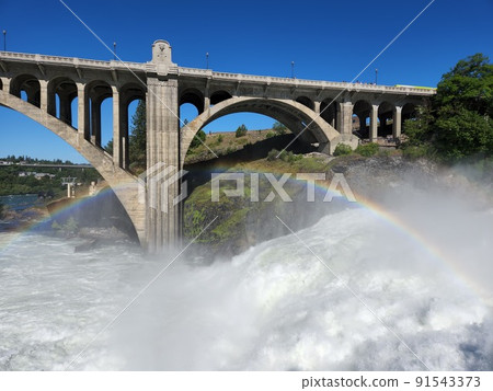 Torrential Lower Spokane Falls after heavy rains on sunny summer morning. 91543373
