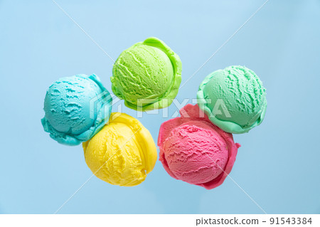 Flying ice cream balls on bright background Flying ice cream balls on bright background 91543384
