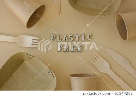 PLASTIC FREE text around Eco friendly, disposable, recyclable, compostable tableware. Paper food boxes, dishes on neutral beige background. Sustainable lifestyle concept. Flat lay PLASTIC FREE text around Eco friendly, disposable, recyclable, compostable tableware. Paper food boxes, dishes on neutral beige background. Sustainable lifestyle concept. Flat lay 91544292