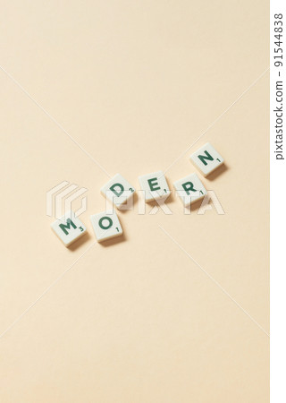 Modern formed of scrabble tiles on beige background. Modern formed of scrabble tiles on beige background. 91544838