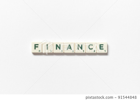 Finance formed of scrabble blocks on white background. 91544848