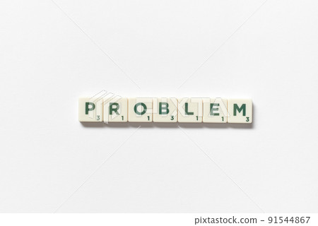 Problem formed of scrabble tiles on white background. Problem formed of scrabble tiles on white background. 91544867