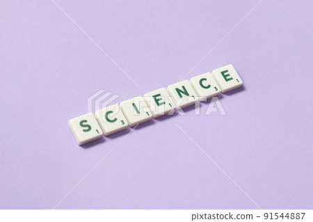 Science formed of scrabble elements on lilac background. 91544887