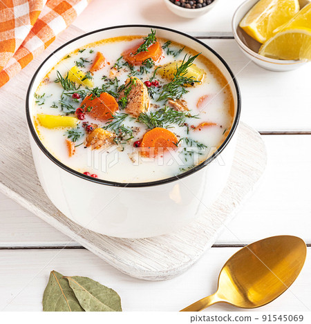 Lohikeitto, Finnish creamy salmon soup in a white bowl Lohikeitto, Finnish creamy salmon soup in a white bowl 91545069
