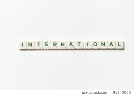 International formed of scrabble blocks on white background. International formed of scrabble blocks on white background. 91545090