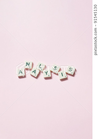 Analysis formed of scrabble blocks on pink background. Analysis formed of scrabble blocks on pink background. 91545130