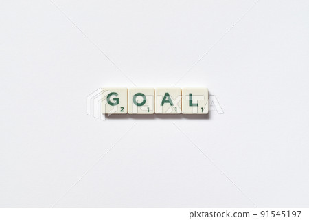 Goal formed of scrabble blocks on white background. 91545197