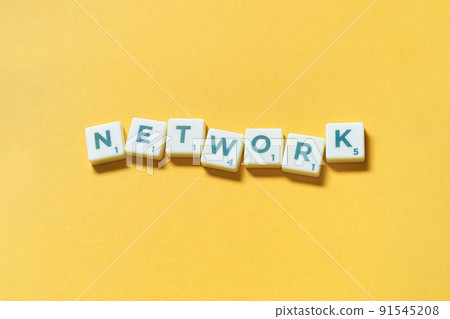 Network formed of scrabble elements on yellow background. 91545208