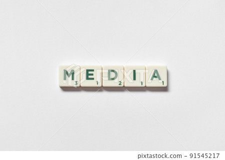 Media formed of scrabble blocks on white background. 91545217