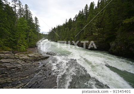 Torrential McDonald Creek in Glacier National Park, Montana after heavy rains. Torrential McDonald Creek in Glacier National Park, Montana after heavy rains. 91545401