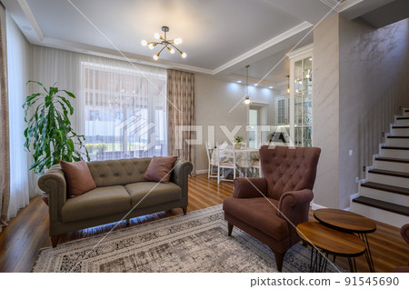 Studio apartment living room with white large kitchen and dining table Studio apartment living room with white large kitchen and dining table 91545690