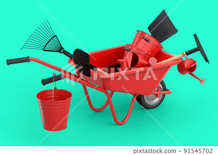 Garden wheelbarrow with garden tools like shovel, watering can and fork on green 91545702