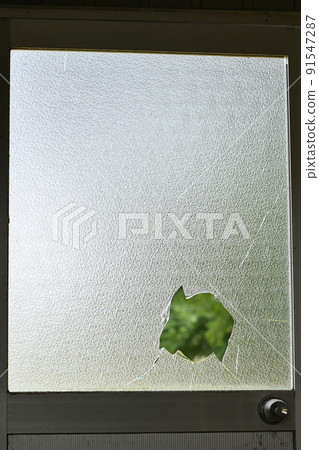Broken window glass 91547287