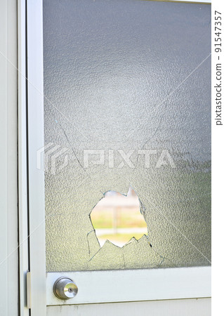 Broken window glass 91547357