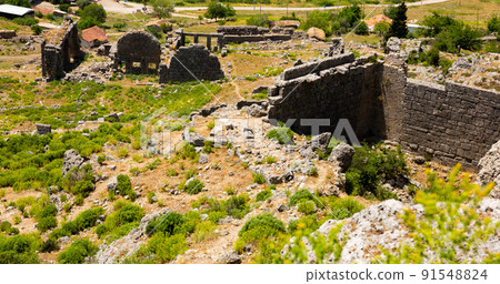 Ruins of ancient city Sillyon. Ancient ruins with roman baths Ruins of ancient city Sillyon. Ancient ruins with roman baths 91548824