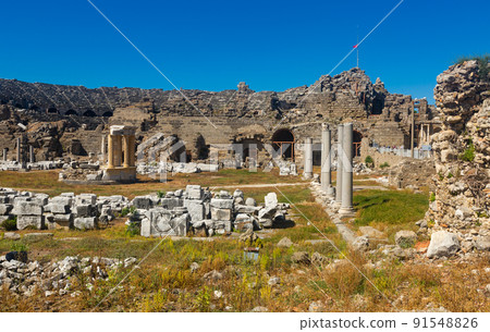 Ancient city ruins. Side. Colonnaded road and market place Ancient city ruins. Side. Colonnaded road and market place 91548826