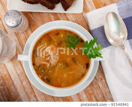Portion of russian soup rassolnik in eatery Portion of russian soup rassolnik in eatery 91548941