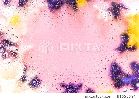 Floral background. Various daffodil flower heads, hyacinth blurred top view flat lay with water drops on the glass. Deep purple, pink, white, yellow colors. Copy space for text. High quality photo 91553584