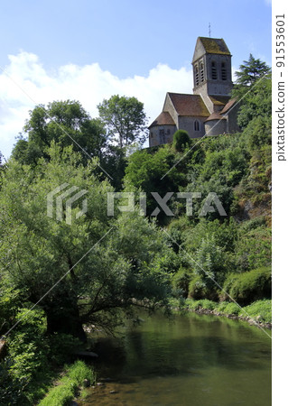 A church standing on a hill and a landscape of fresh greenery A church standing on a hill and a landscape of fresh greenery 91553601