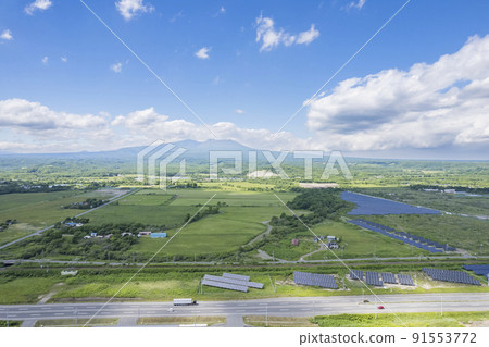 Aerial view of the area around Tomakomai, Hokkaido (landscape with solar panels) Aerial view of the area around Tomakomai, Hokkaido (landscape with solar panels) 91553772