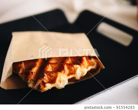 Appetizing waffles on a showcase of a cafe i Appetizing waffles on a showcase of a cafe i 91554283
