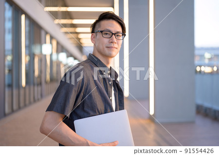 Male portrait with a personal computer Middle Male portrait with a personal computer Middle 91554426
