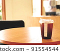 Ice coffee, americano coffee with orange in cafe. 91554544