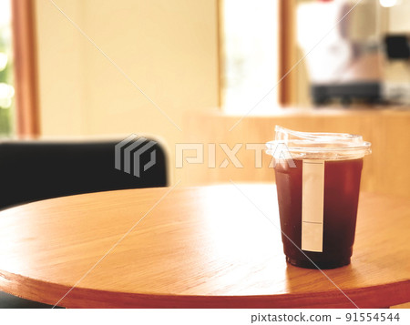 Ice coffee, americano coffee with orange in cafe. Ice coffee, americano coffee with orange in cafe. 91554544