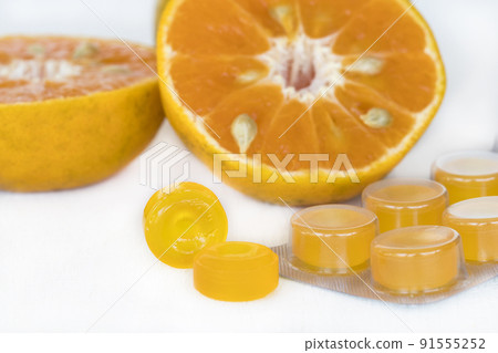 cough sore throat pastille extract orange fruits arrangement flat lay style 91555252
