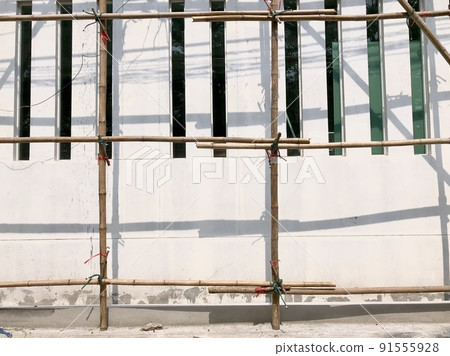 bamboo sticks are tile together to be base on painter 91555928