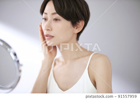 Middle woman worried about fine wrinkles Middle woman worried about fine wrinkles 91557959