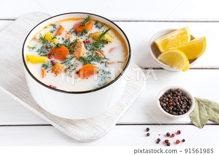 Lohikeitto, Finnish creamy salmon soup in a white bowl Lohikeitto, Finnish creamy salmon soup in a white bowl 91561985