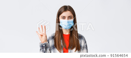 Coronavirus outbreak, leisure on quarantine, social distancing and emotions concept. Cheerful attractive woman in medical mask showing number four, make order, white background Coronavirus outbreak, leisure on quarantine, social distancing and emotions concept. Cheerful attractive woman in medical mask showing number four, make order, white background 91564654