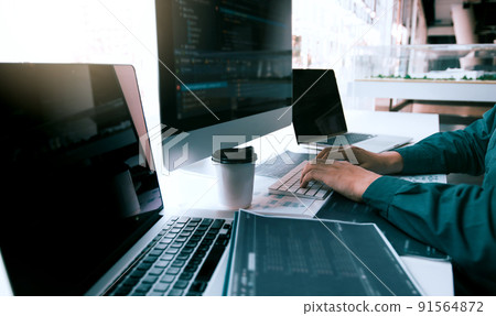 Asian man working code program developer computer web development working design software on desk in office. 91564872