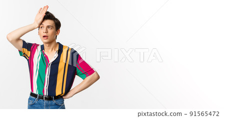 Tired queer man facepalm and sighing distressed, standing against white background troubled Tired queer man facepalm and sighing distressed, standing against white background troubled 91565472